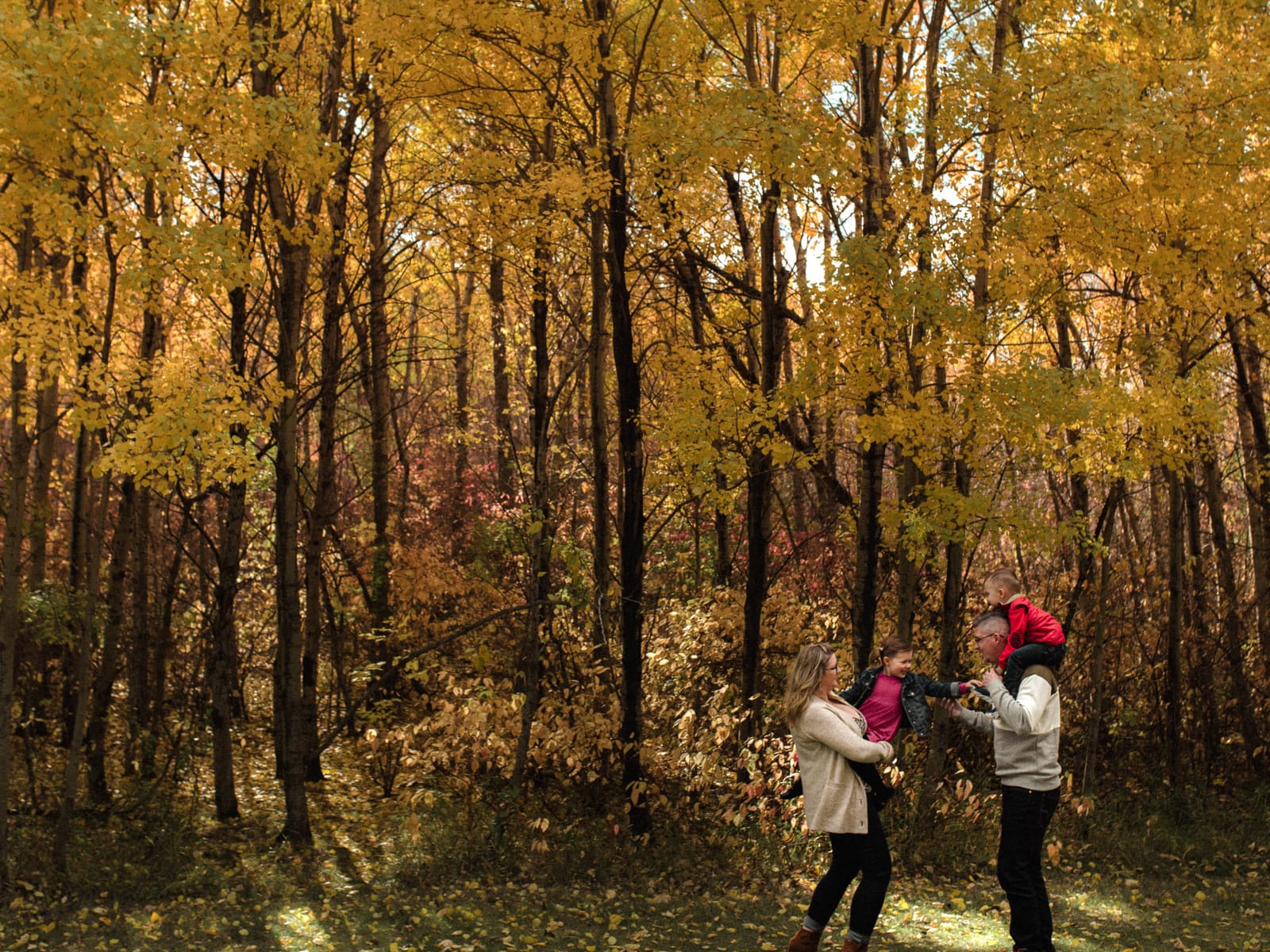 Family photography Edmonton — family walking together